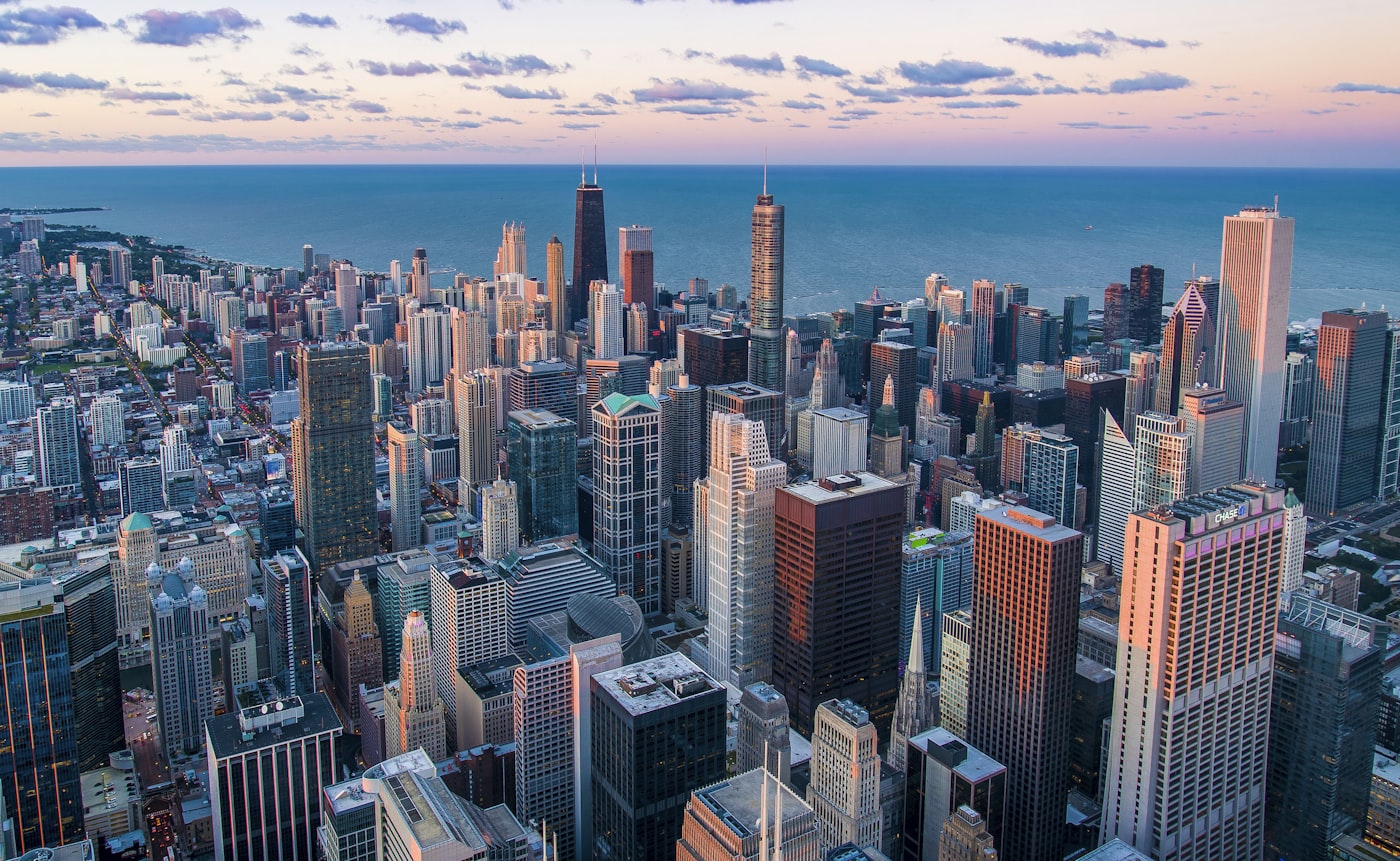Financial city skyline stretching to the horizon at dusk